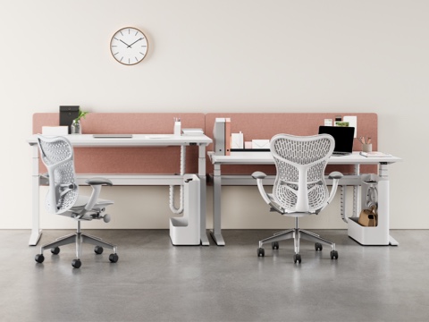 A Locale collaboration space featuring height-adjustable surfaces, a small table, a low workbase, beige privacy screens, and Setu and Aeron office chairs.