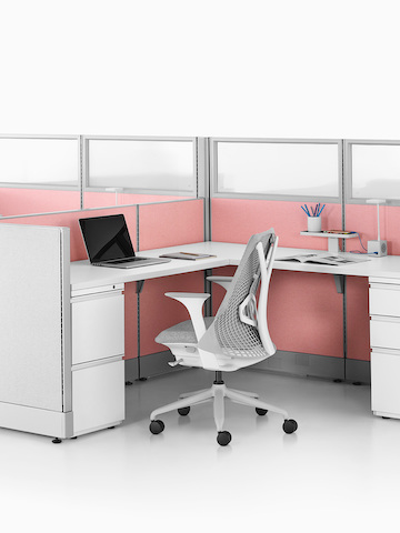 Two Action Office System open workstations with gray Sayl office chairs. Select to go to the Action Office System product page.