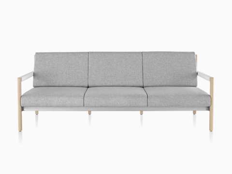 A light gray Brabo sofa with wood legs and white arms, viewed from the front.