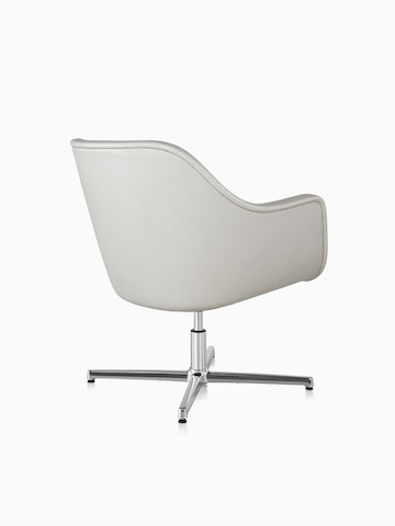 Three-quarter rear view of a white leather Bumper Chair with a four-star base.