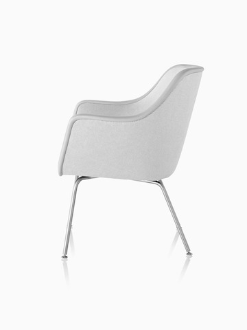 Four-leg Bumper Chair in light gray fabric, viewed from the side.