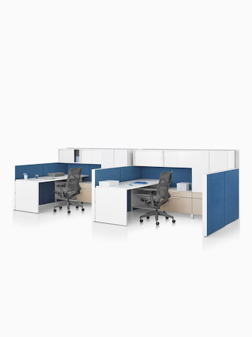 A Canvas Wall workstation with blue panels and white overhead storage, and dark grey Cosm office chairs. Select to go to the Canvas Wall product page.