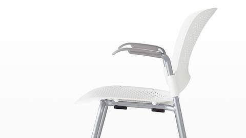 Profile view of a white Caper Stacking Chair.