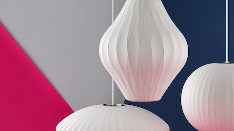 Three white Nelson Bubble Lamps. Select to go to the Nelson Bubble Lamps product page.