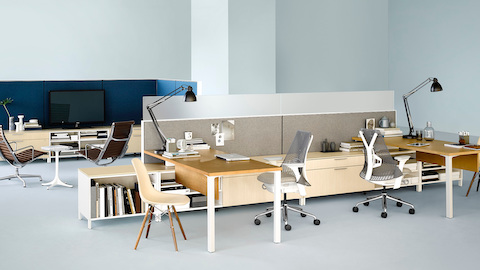 An open, shared workspace outfitted with Canvas Office Landscape workstations and storage. Select to learn more about this comprehensive furniture system.