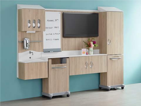 A light wood finish Compass System footwall in patient room setting.