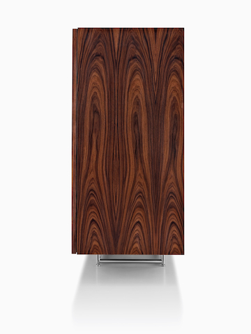 Side view of a Domino Storage sideboard, focusing on the rich wood finish. 