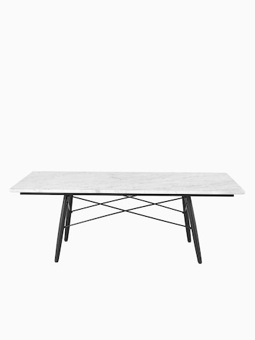 Una mesa de centro rectangular Eames con una tapa blanca.