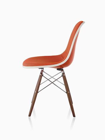 Eames Molded Fiberglass Side Chair in Red Orange upholstered in Hopsak Orange with Walnut Dowel Base.