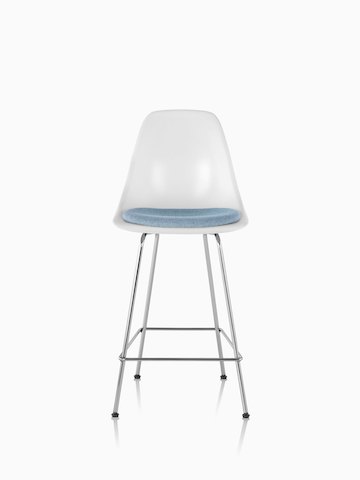 White Eames Molded Fiberglasss Stool with a light blue seat pad, viewed from the front. 