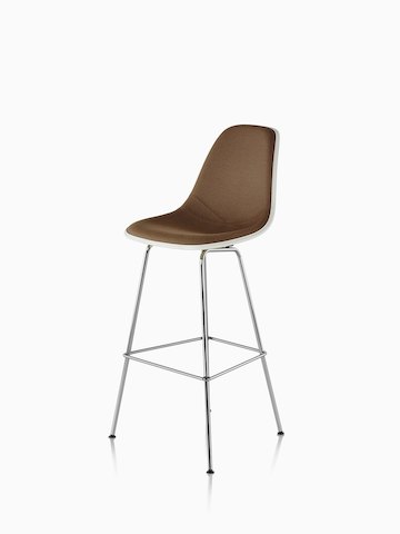 White Eames Molded Fiberglass Stool with brown upholstery, viewed from a 45-degree angle. 