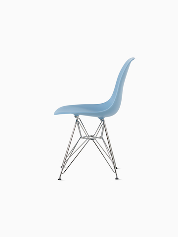 Gray upholstered Eames Molded Plastic armchair with a wire base, viewed from the front.