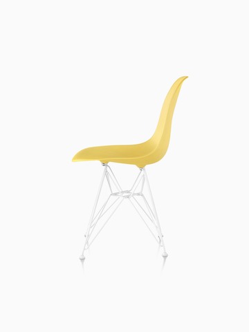 Yellow Eames Molded Plastic side chair with a wire base, viewed from the side.
