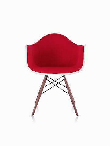Red upholstered Eames Molded Plastic armchair with dowel legs, viewed from the front.