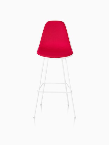 White Eames Molded Plastic Stool with red upholstery, viewed from the front. 