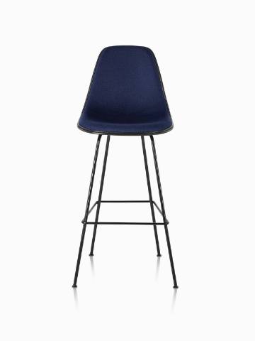 Black Eames Molded Plastic Stool with navy blue upholstery, viewed from the front. 