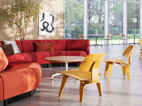 Front lobby including the Chadwick Sofa and Eames Molded Plywood Chair (LCW) in yellow stain.