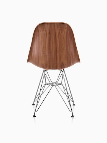 Eames Molded Wood side chair with a medium finish and wire base, viewed from the rear.