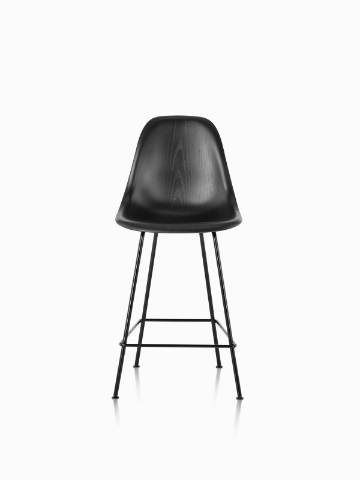 Black Eames Molded Wood Stool with black legs, viewed from the front. 