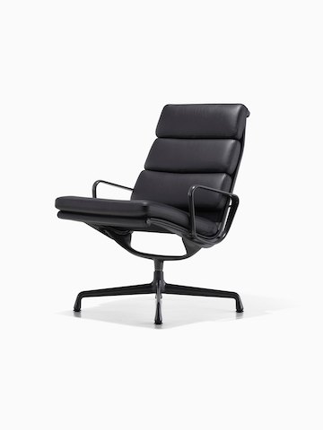 Black leather Eames Soft Pad lounge chair, viewed from a 45-degree angle.