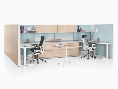 Ethospace shared workspace with wood panels, storage units, and black Embody ergonomic desk chairs.