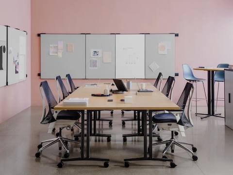 Everywhere Tables in a workshop setting with locker storage and project work pinned on boards attached to the walls.