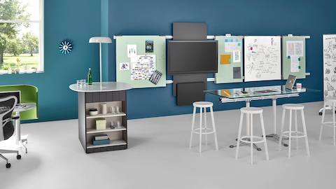 A wall-hung media tile and wall-hung display boards from Exclave promote idea sharing in a collaboration space.