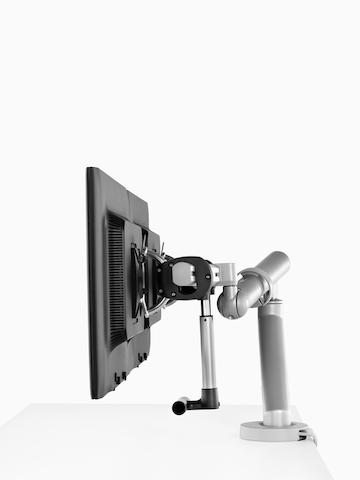 Side-by-side monitors supported by a sturdy Flo Monitor Arm.