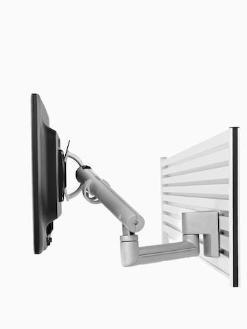 An adjustable Flo Monitor Arm designed for panel-mounted rail systems.