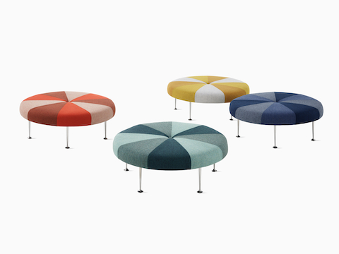 Four Girard Colour Wheel Ottomans, all upholstered in various fabrics.