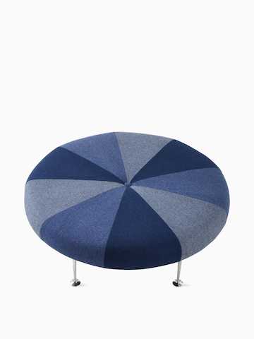 A Girard Color Wheel Ottoman upholstered in blue fabrics, viewed from the top. Select to go to the Girard Color Wheel Ottoman product page.