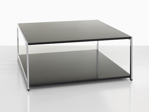 A rectangular H Frame coffee table with a black top and black lower shelf. 