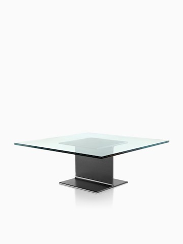 Una mesa Beam I con una tapa de cristal. Seleccione para ir a la página del producto I Beam Tables.