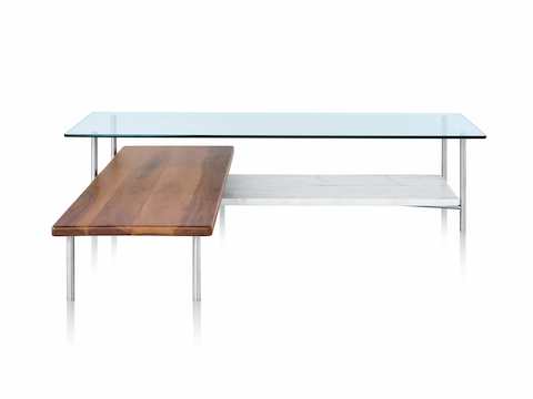 A glass top L-shaped Layer coffee table with two wood lower shelves.