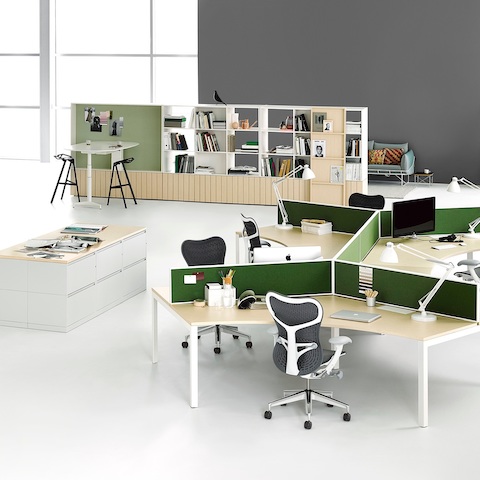 A workspace with two 120-degree Layout Studio workstations with privacy screens and Mirra 2 Chairs, lateral files, and Locale storage and bookcase.