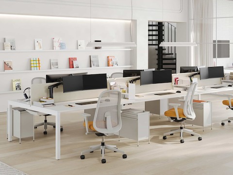 A Layout Studio workstation with dual monitors and Lino Chairs.