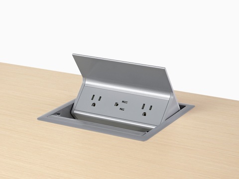 A gray, grommet-mounted Logic power port with three power outlets.