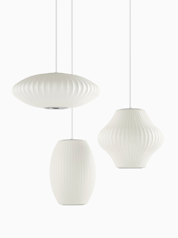 Three white Pendant lamps. Select to go to the Nelson Bubble Lamps product page.