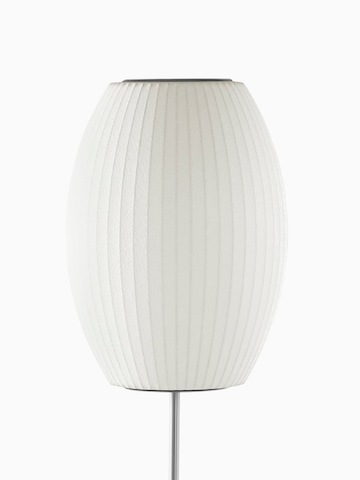 Una lámpara de pie blanca. Seleccione para ir a la página del producto Nelson Cigar Lotus Floor Lamp.