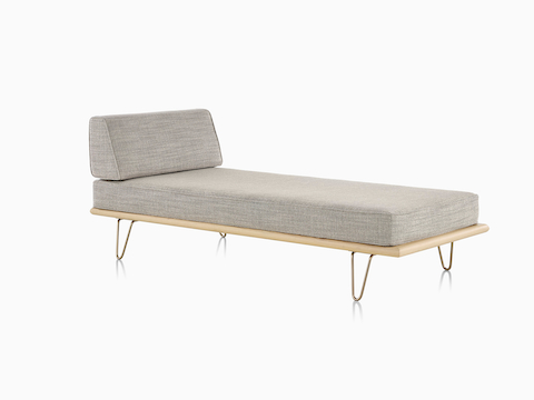 A light gray Nelson Daybed in the lounge position with a removable side bolster in place, viewed from a 45-degree angle. 