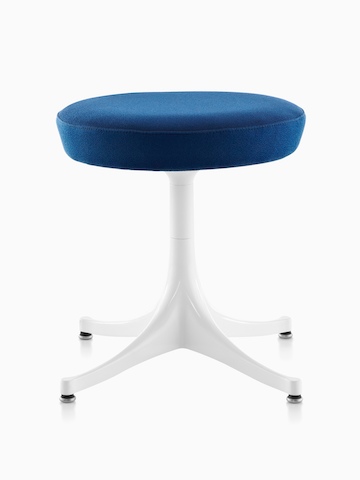 Nelson Pedestal Stool with a blue upholstered seat and white base. 