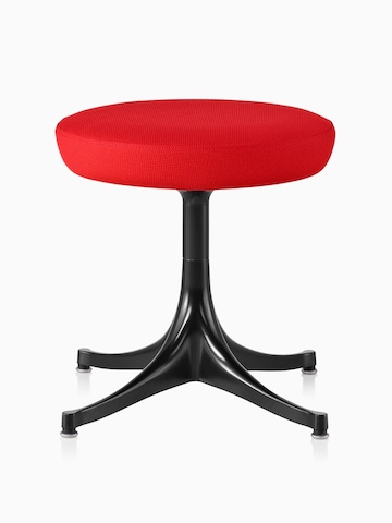 Nelson Pedestal Stool with a red upholstered seat and black base.