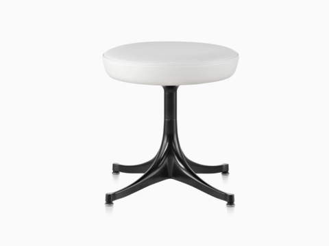 Nelson Pedestal Stool with a white leather seat and black base.
