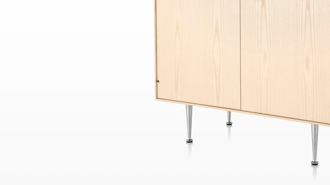 Close view of the slim aluminum legs on a Nelson Thin Edge storage unit. 