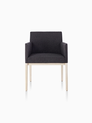 Black Nessel Chair with arms and light wood base, viewed from the front.