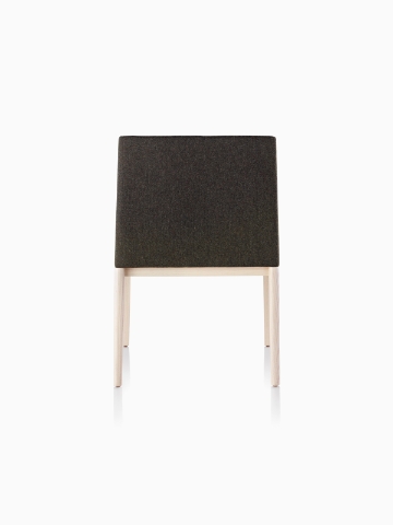 Black Nessel Chair with light wood base, viewed from the back.