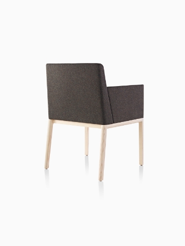 Black Nessel Chair with arms and light wood base, viewed from the back at an angle.