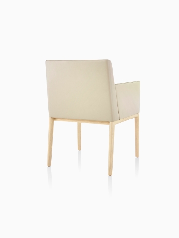 Tan Nessel Chair with arms, viewed from the back at an angle.