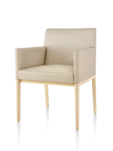 Tan Nessel Chair with arms and light wood base, viewed from the front at an angle.