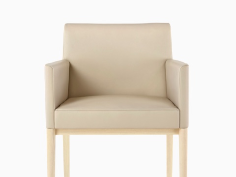 Tan Nessel Chair with arms and light wood base, viewed from the front.